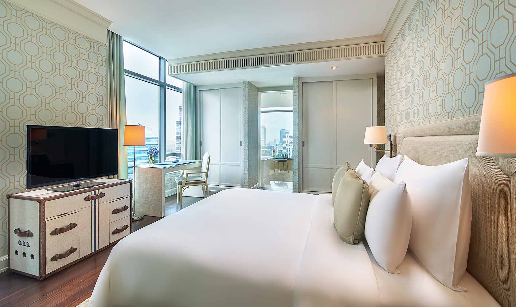 King-sized bed in master bedroom in Two Bedroom Suite - Oriental Residence Bangkok
